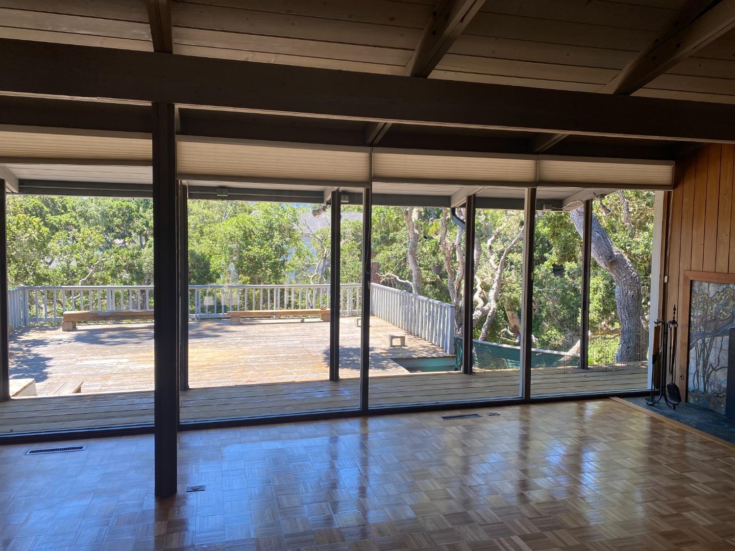 325 Vía Del Rey Monterey, CA 93940 - Photo 3 of 9 a view of empty room with wooden floor and floor to ceiling window