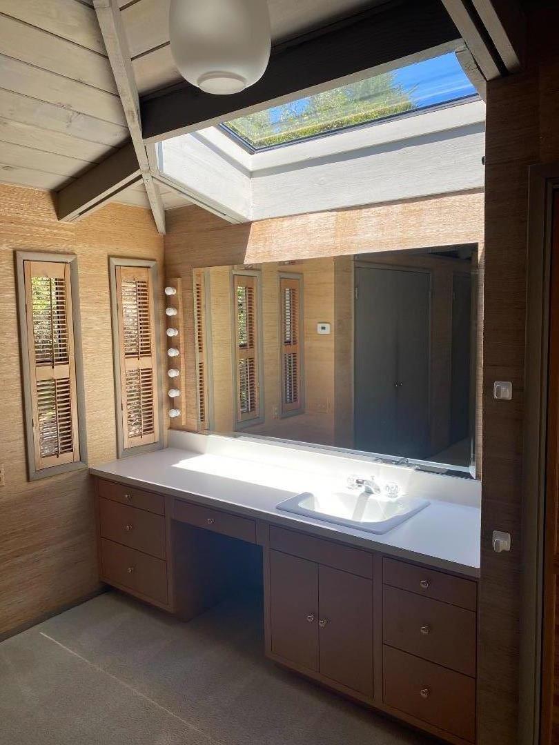 325 Vía Del Rey Monterey, CA 93940 - Photo 8 of 9 a bathroom with a sink and a mirror
