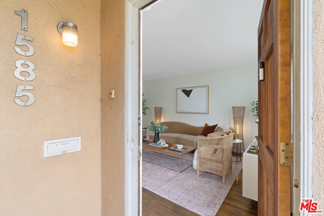 1585 Forest Avenue Pasadena, CA 91103 - Photo 2 of 28 a living room with furniture and a table