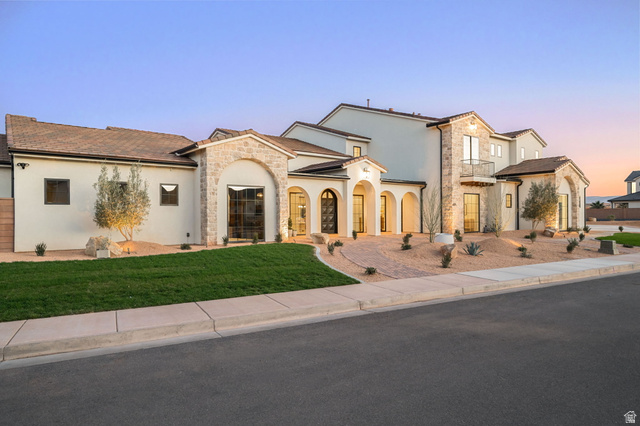 4871 South Homestead Way Washington, UT 84780 - Photo 2 of 151 View of front facade featuring stone siding, stucco siding, and a yard
