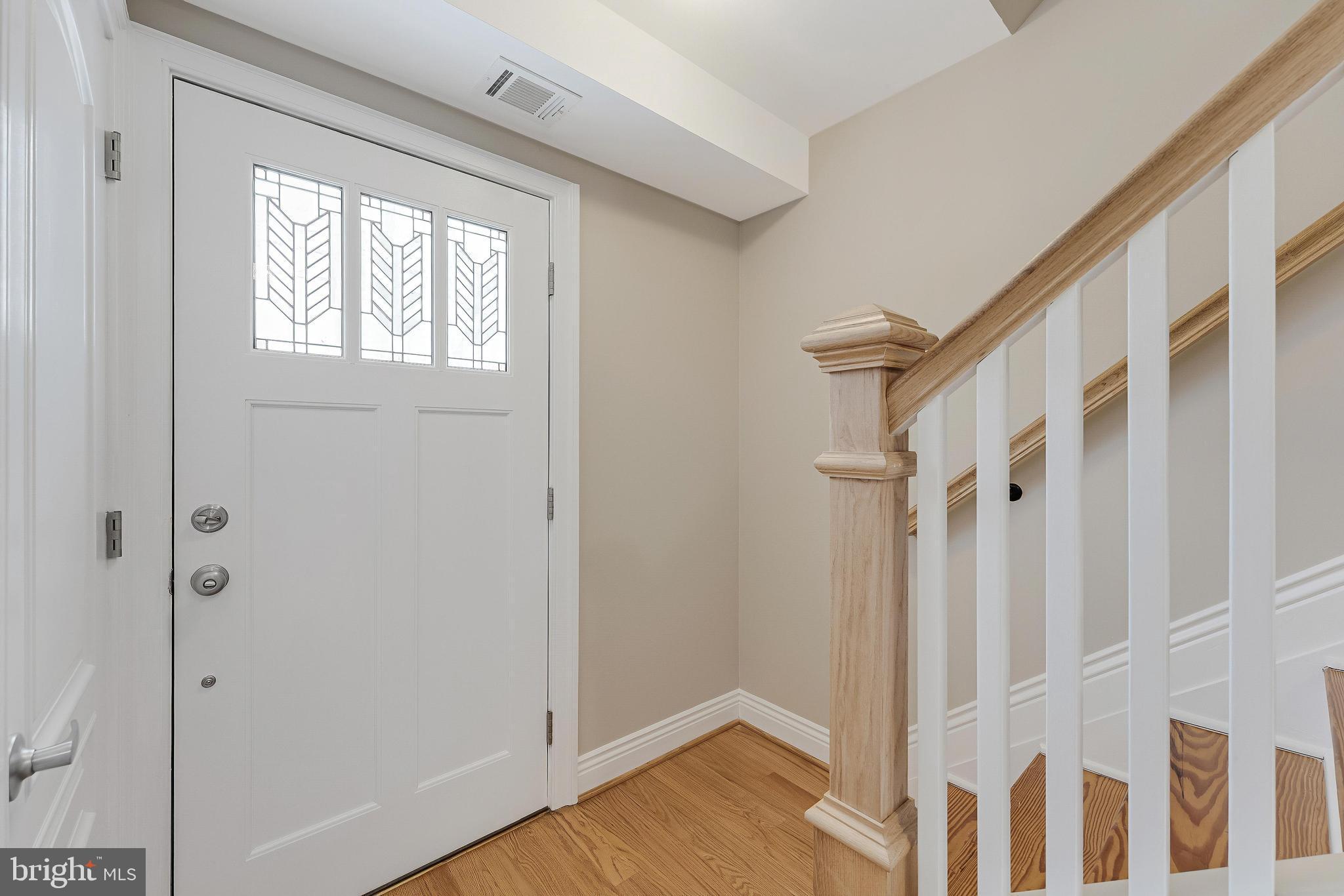 814 Geranium Street Northwest Washington, DC 20012 - Photo 11 of 51 a view of a hallway with wooden floor and entryway