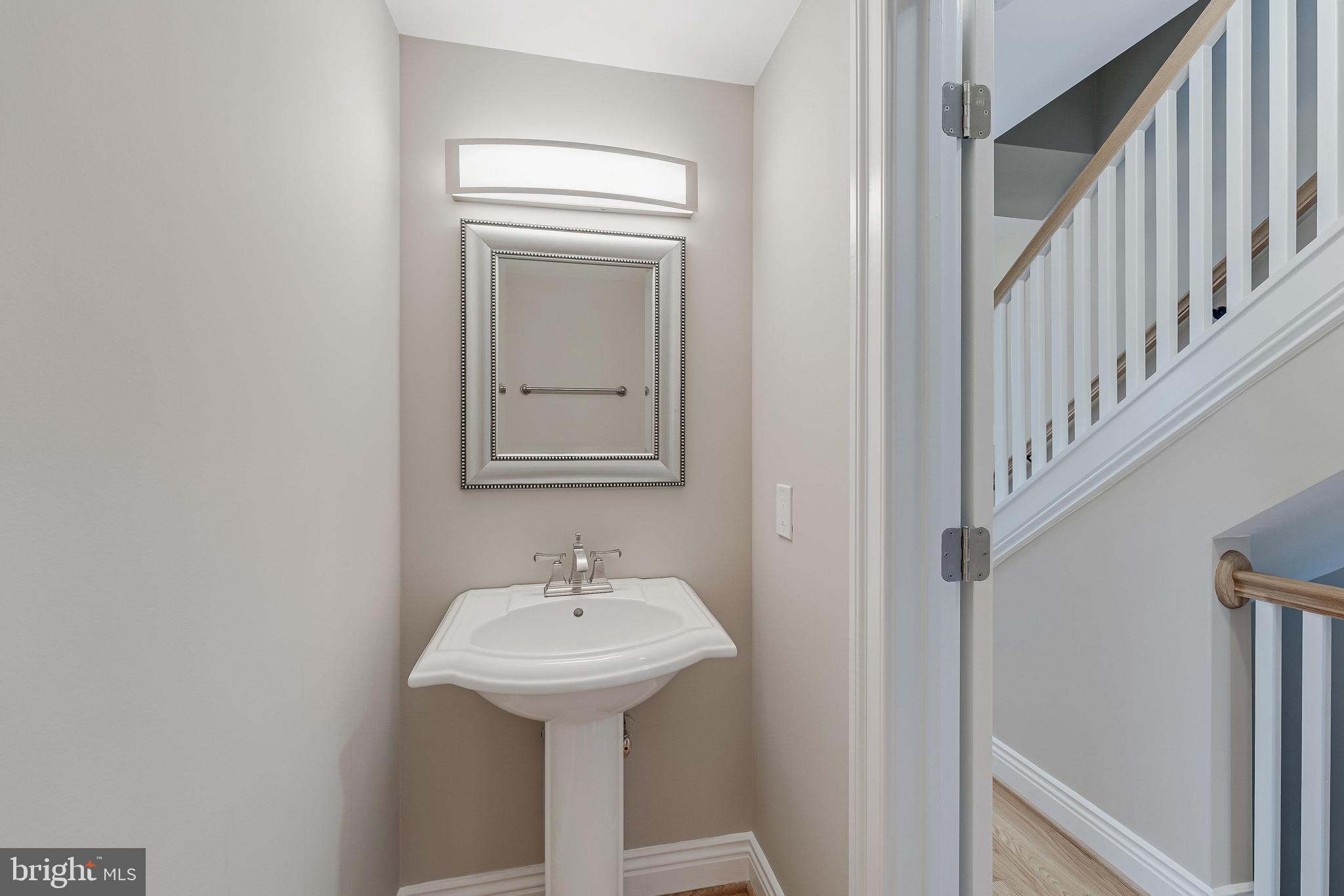 814 Geranium Street Northwest Washington, DC 20012 - Photo 13 of 51 a bathroom with a sink and mirror