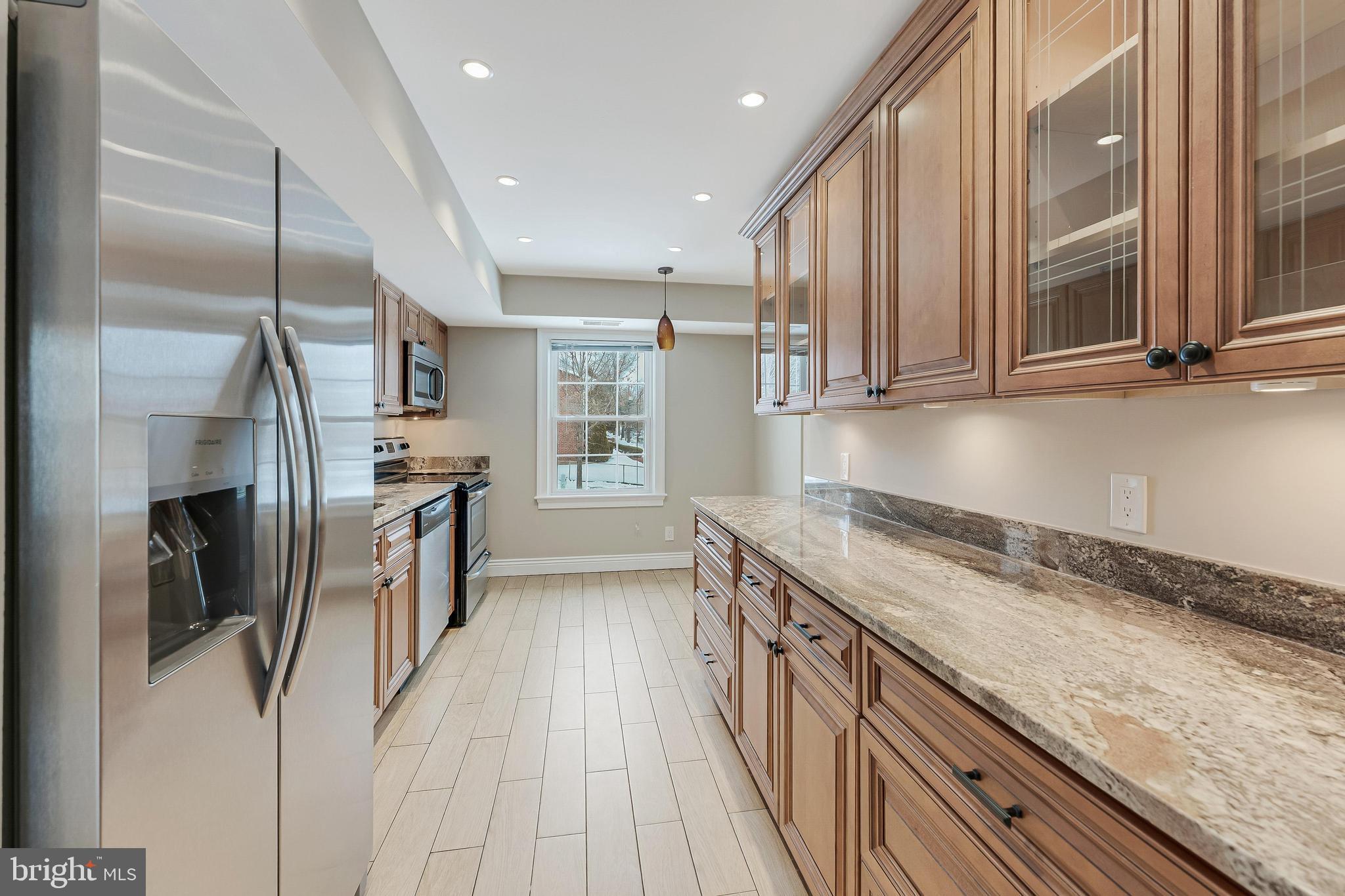 814 Geranium Street Northwest Washington, DC 20012 - Photo 17 of 51 a kitchen with stainless steel appliances granite countertop a refrigerator a stove and a sink