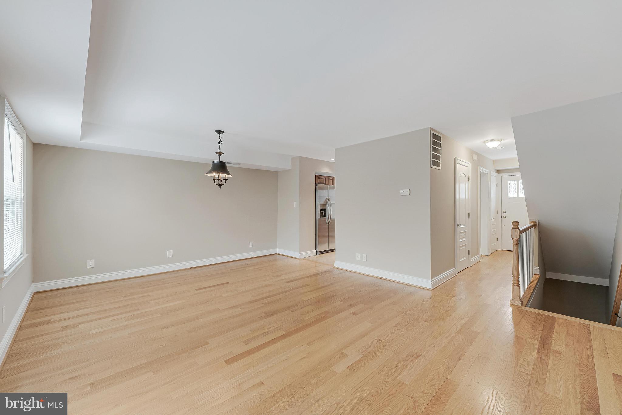 814 Geranium Street Northwest Washington, DC 20012 - Photo 23 of 51 wooden floor in an empty room with a window
