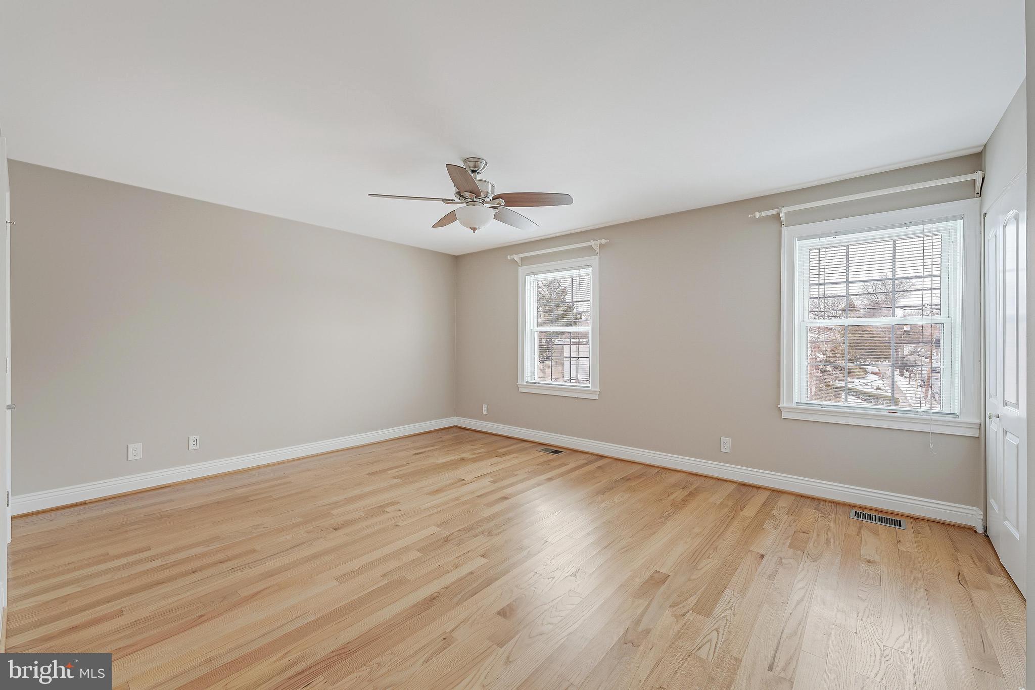 814 Geranium Street Northwest Washington, DC 20012 - Photo 28 of 51 wooden floor in an empty room with a window
