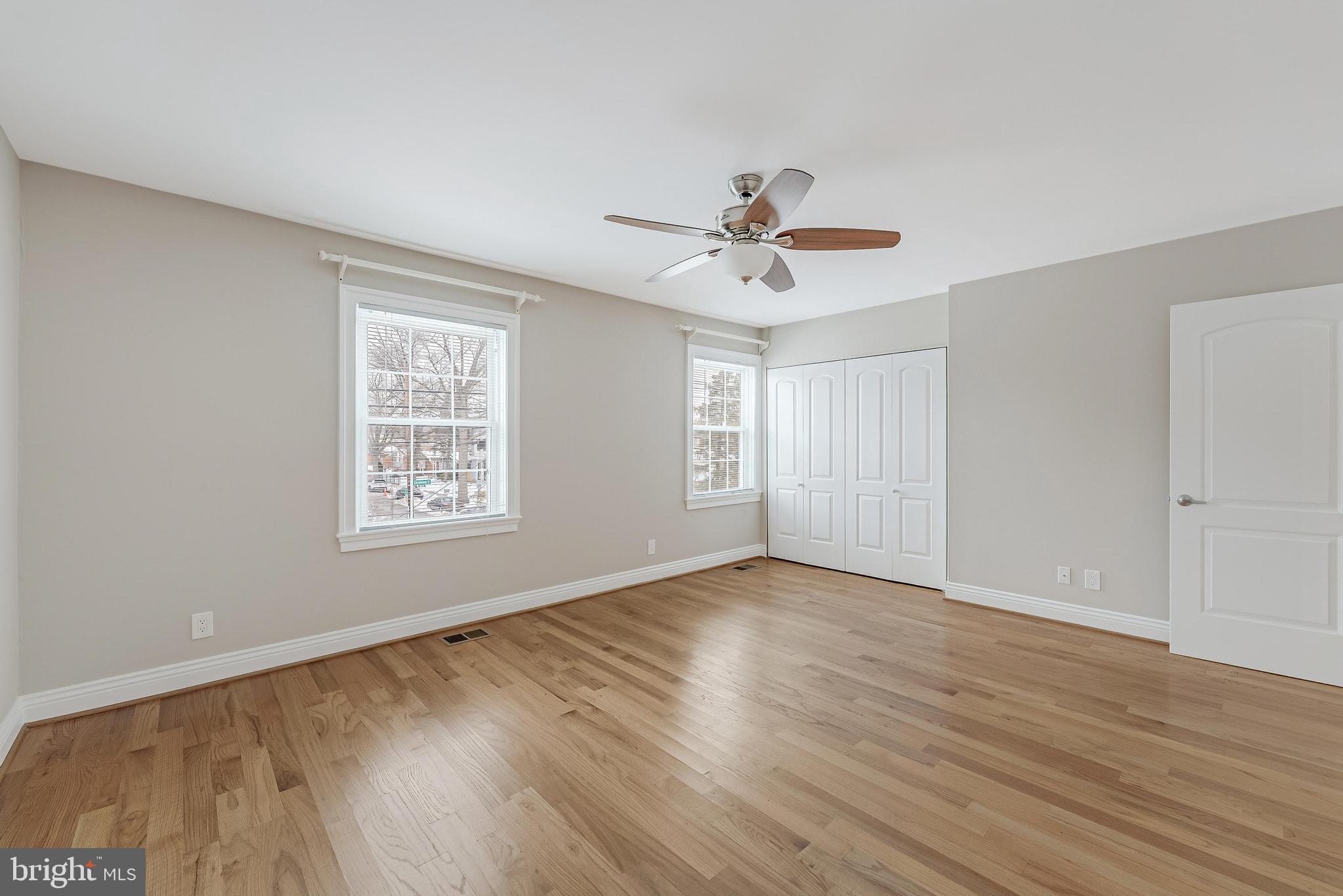 814 Geranium Street Northwest Washington, DC 20012 - Photo 29 of 51 a view of an empty room with a window and wooden floor
