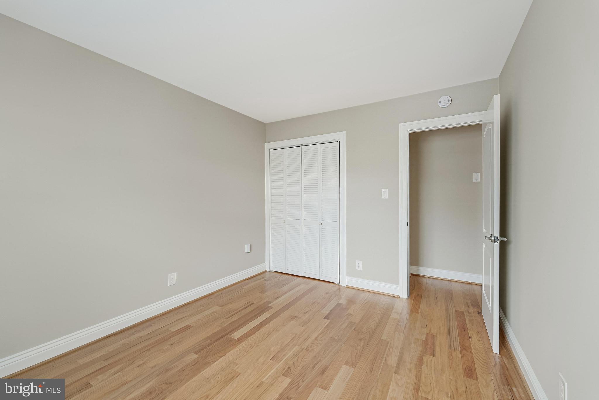 814 Geranium Street Northwest Washington, DC 20012 - Photo 34 of 51 a view of an empty room with wooden floor