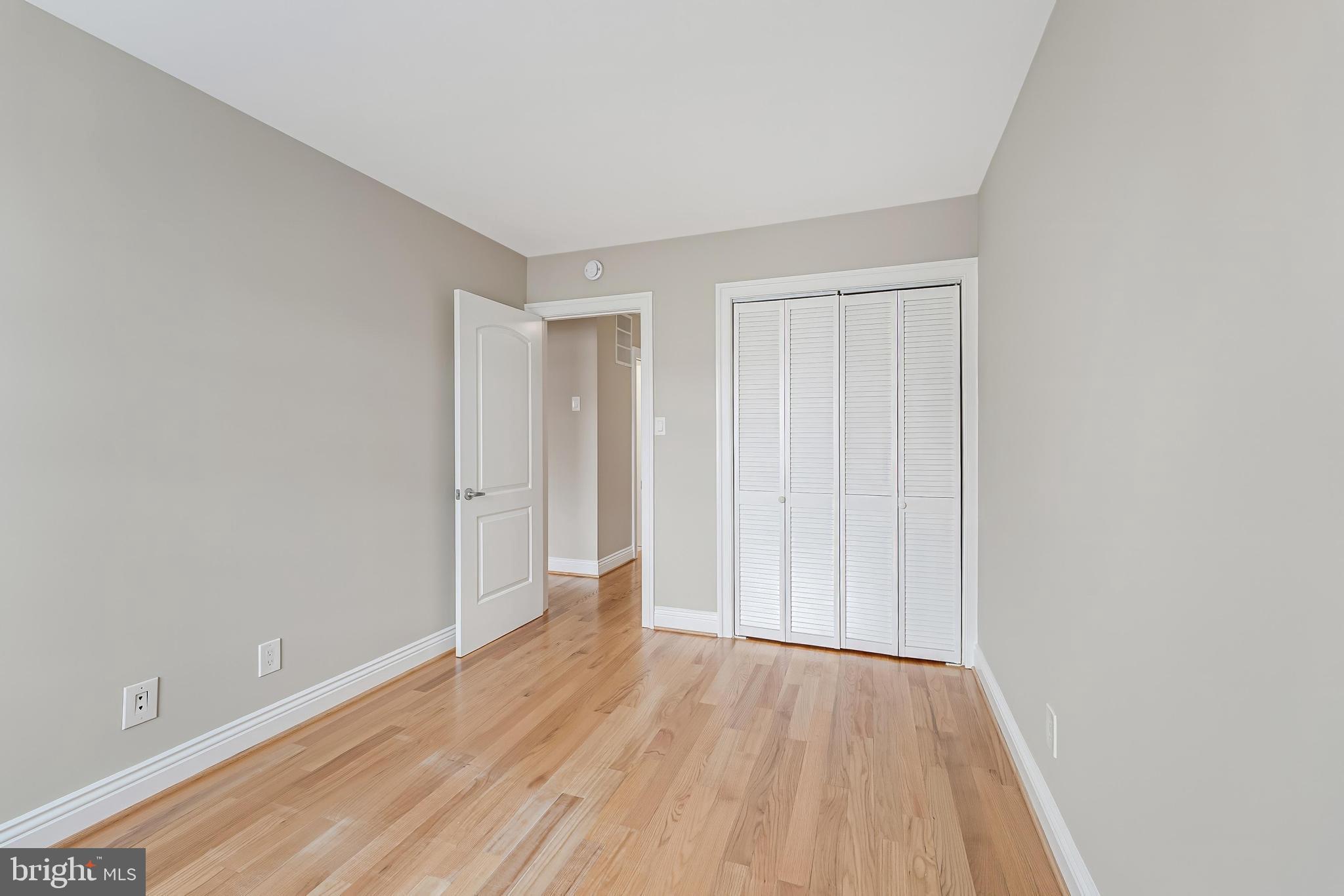 814 Geranium Street Northwest Washington, DC 20012 - Photo 36 of 51 a view of an empty room and wooden floor