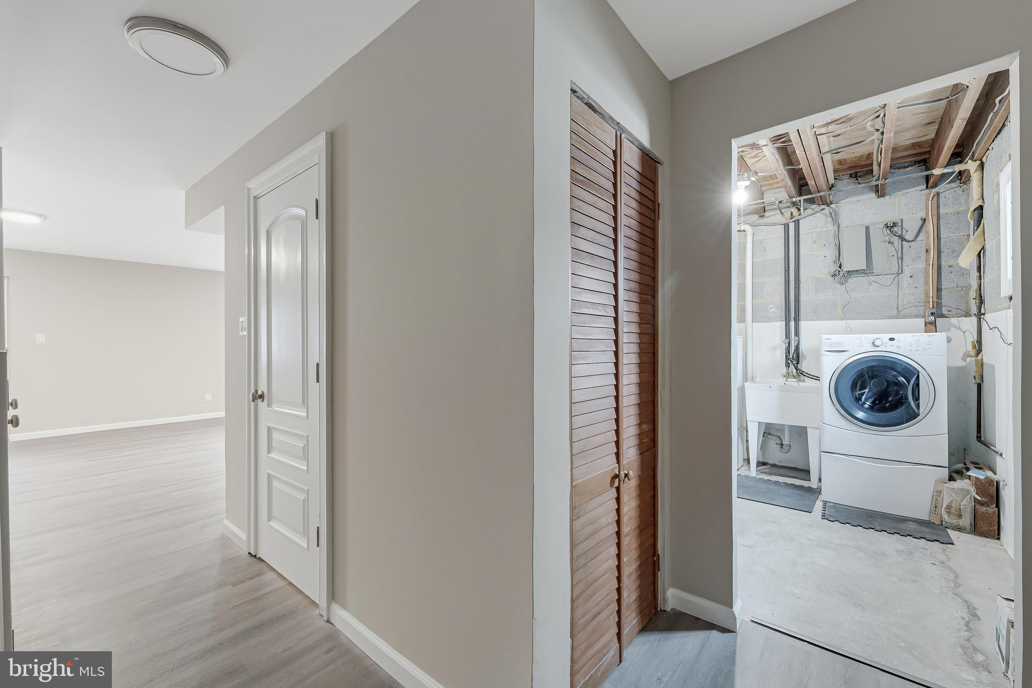 814 Geranium Street Northwest Washington, DC 20012 - Photo 42 of 51 a view of a storage & utility room with washer and dryer