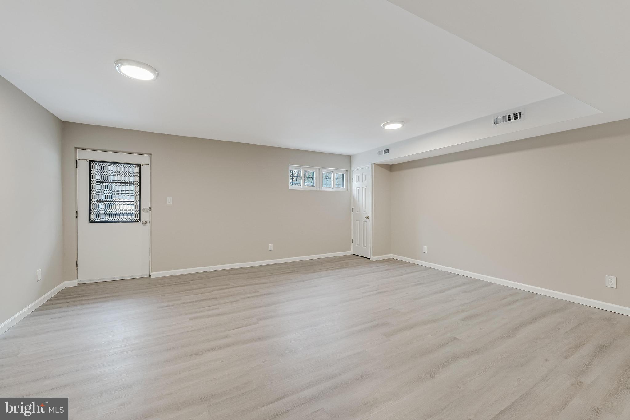 814 Geranium Street Northwest Washington, DC 20012 - Photo 43 of 51 a view of an empty room with a window