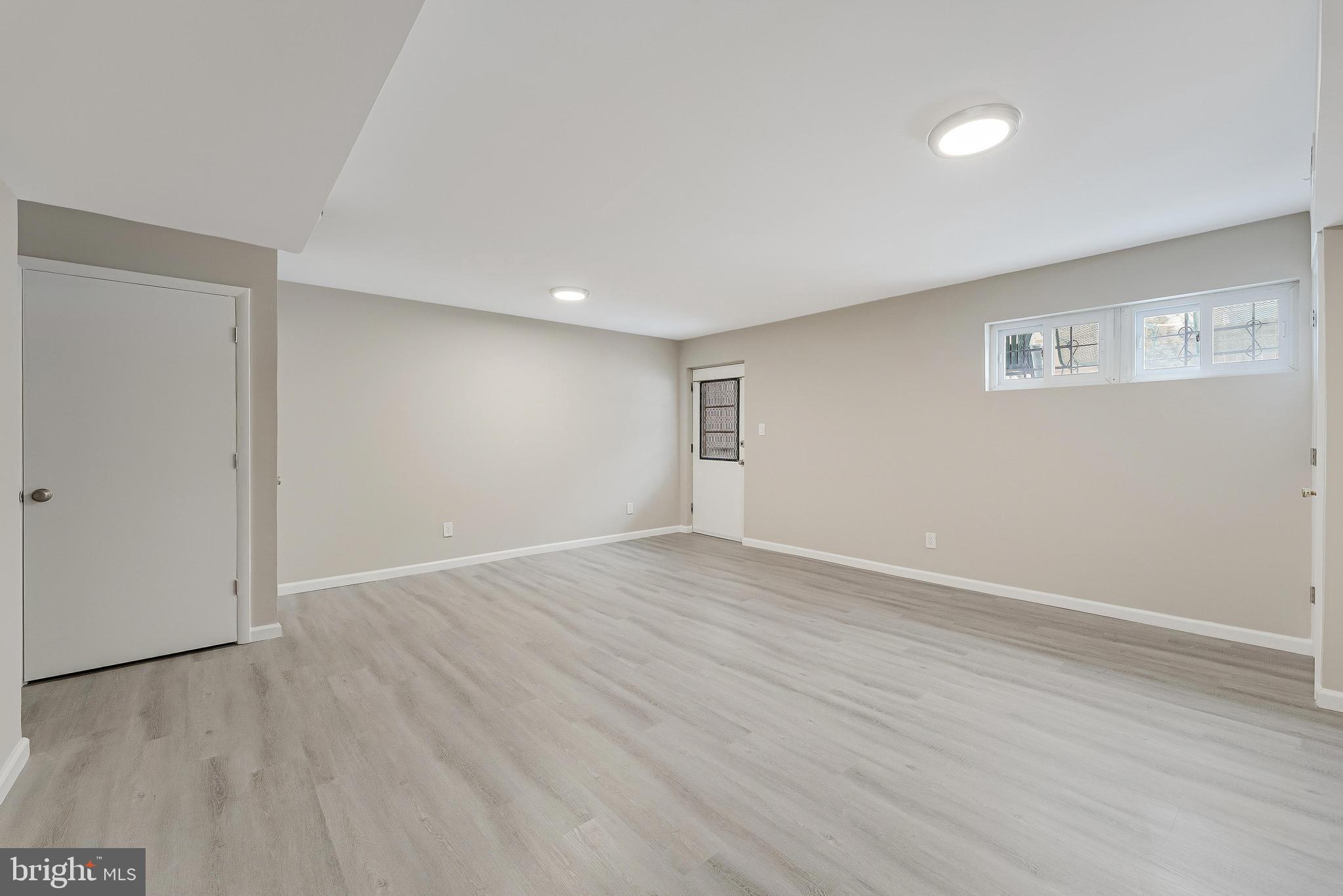 814 Geranium Street Northwest Washington, DC 20012 - Photo 44 of 51 a view of an empty room with wooden floor
