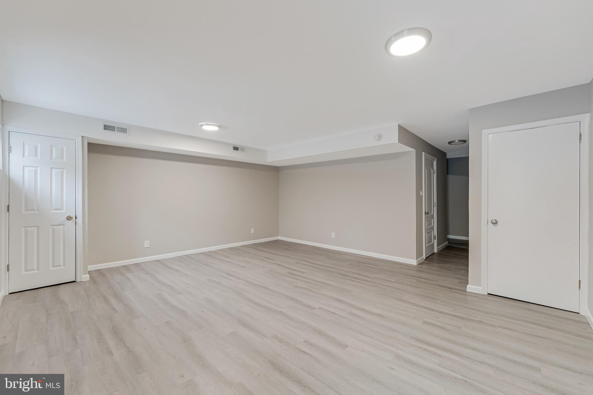 814 Geranium Street Northwest Washington, DC 20012 - Photo 45 of 51 a view of an empty room with wooden floor