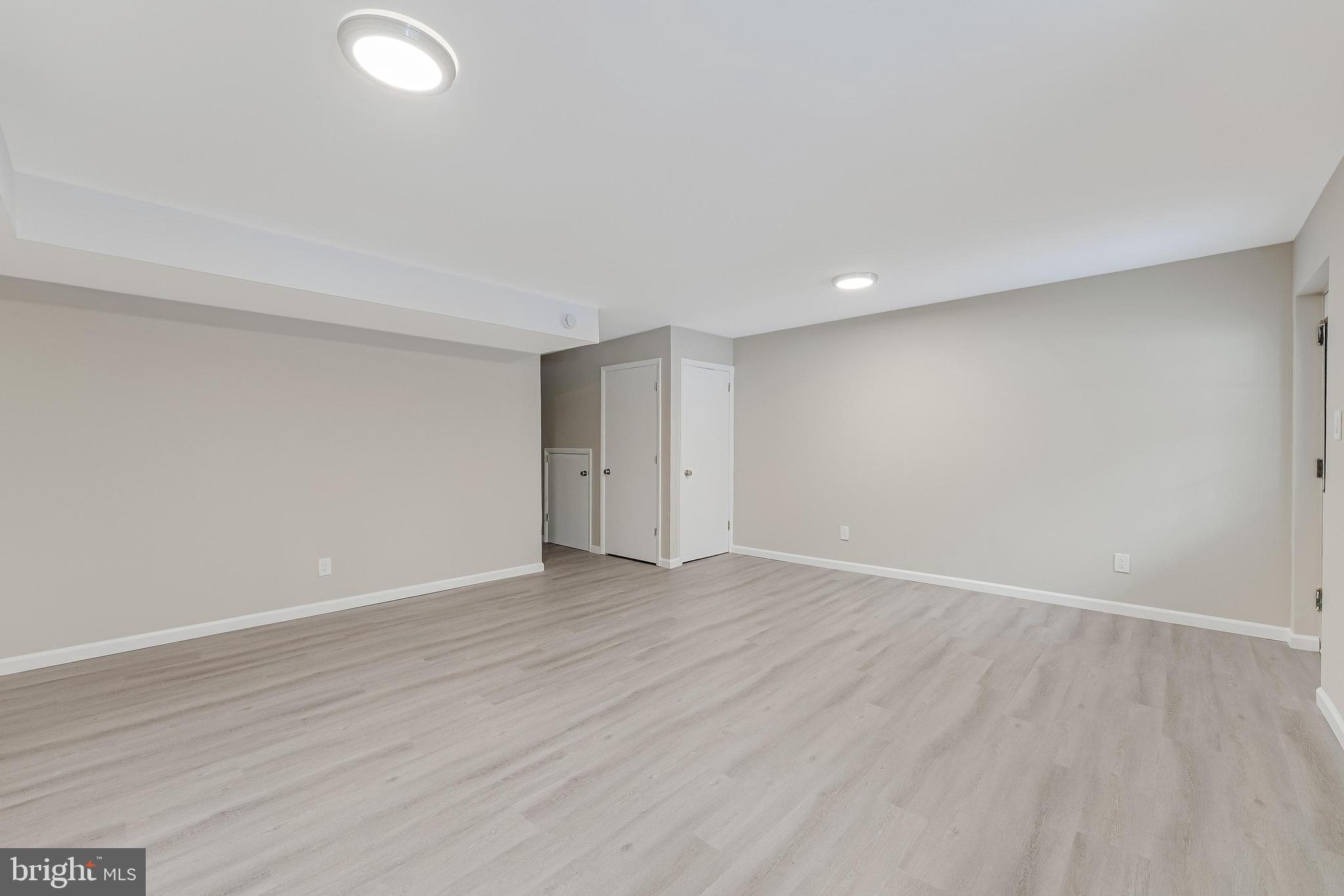 814 Geranium Street Northwest Washington, DC 20012 - Photo 46 of 51 a view of an empty room with wooden floor