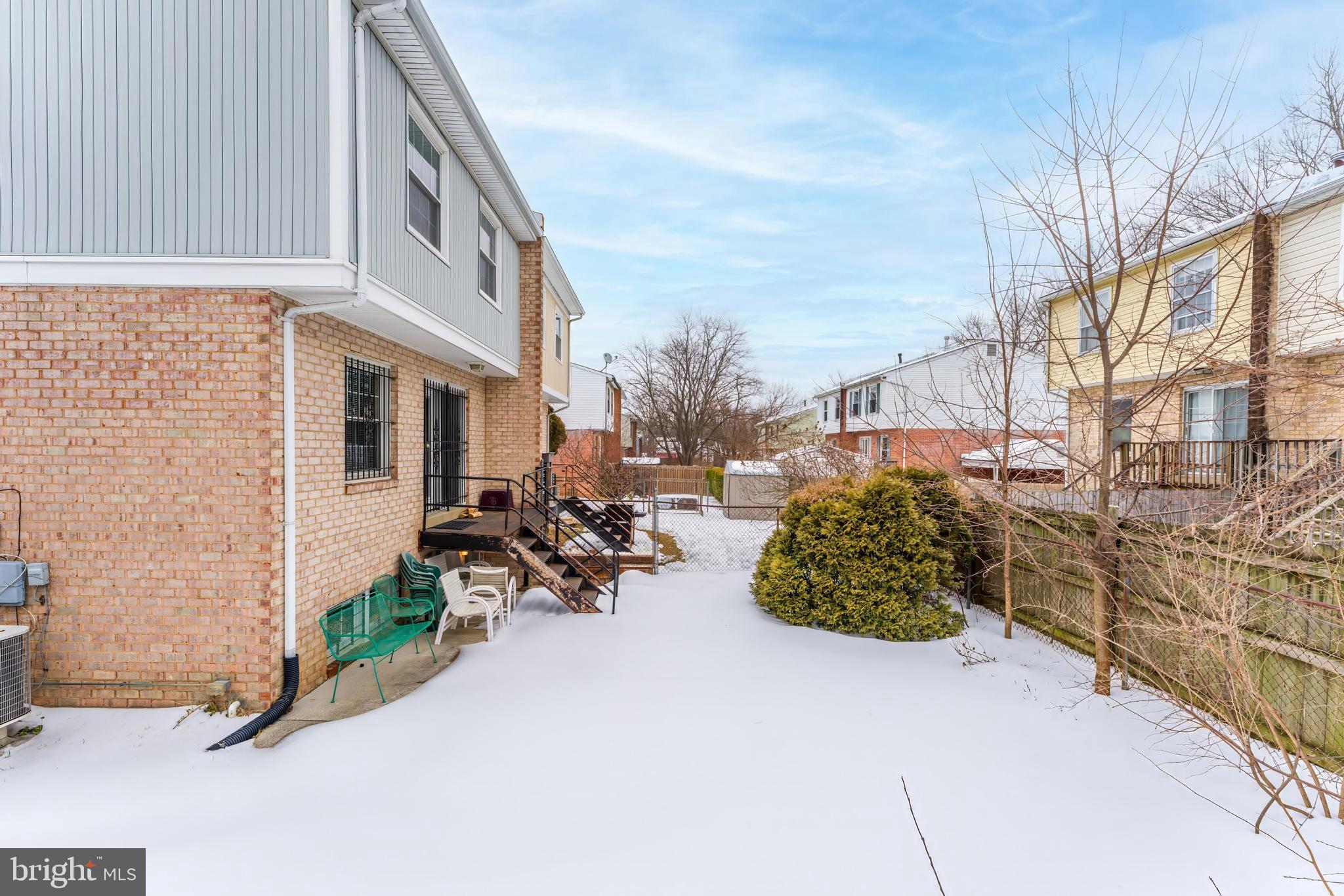 814 Geranium Street Northwest Washington, DC 20012 - Photo 6 of 51 a view of a chair and tables in the back yard of the house