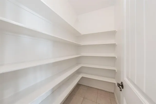 a view of an empty walk in closet