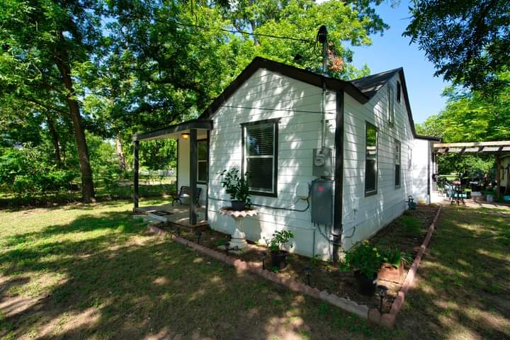 1104 Perry Road Austin, TX 78721 - Photo 1 of 15 a front view of a house with a yard