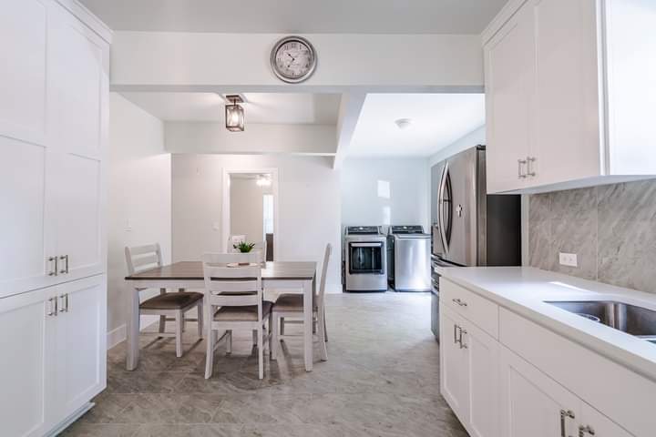 1104 Perry Road Austin, TX 78721 - Photo 2 of 15 a kitchen with a sink cabinets and stainless steel appliances