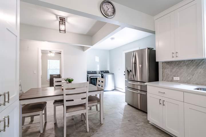 1104 Perry Road Austin, TX 78721 - Photo 3 of 15 a kitchen with a dining table and chairs