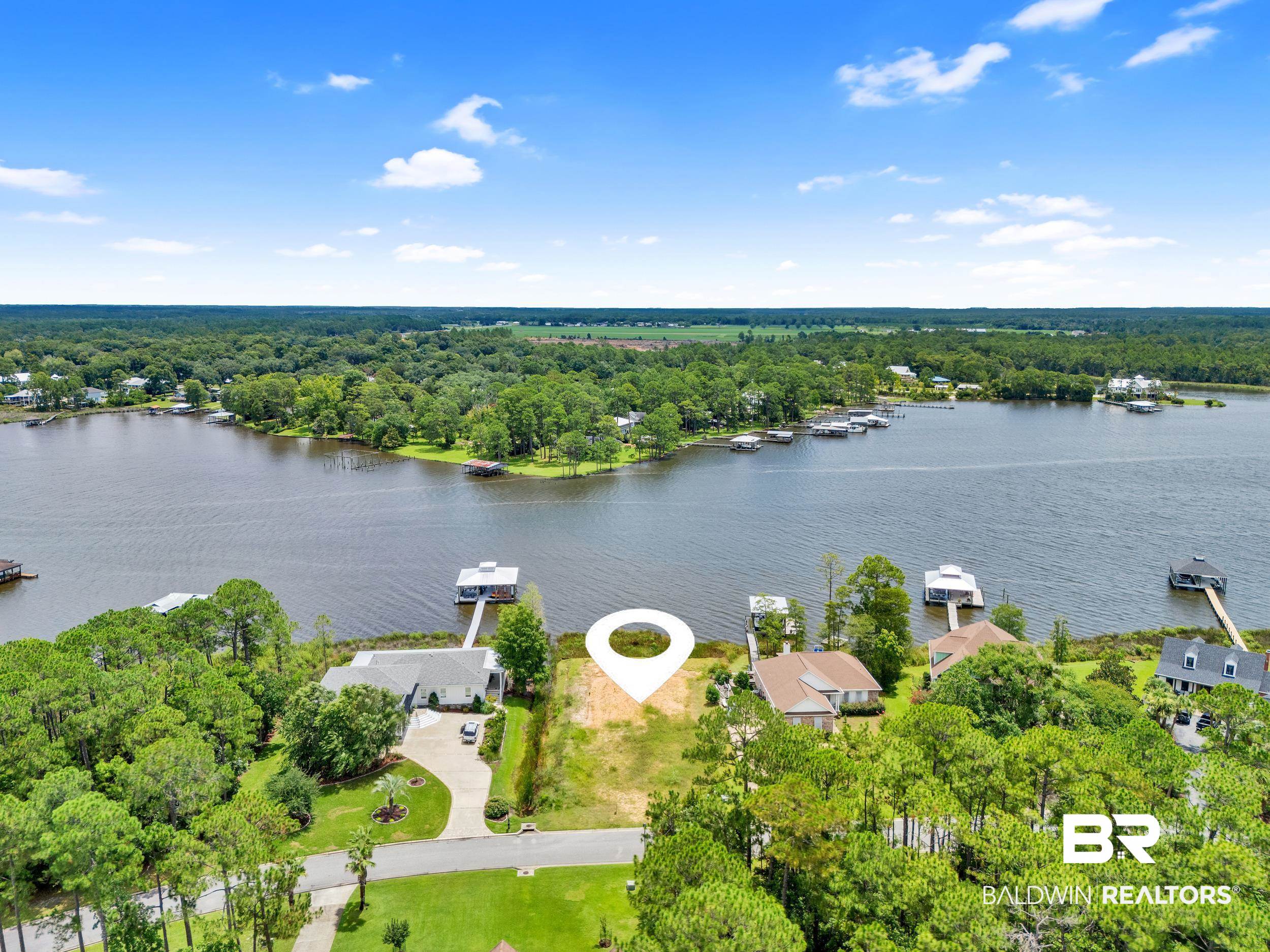 8963 Bay Point Drive Elberta, AL 36530 - Photo 9 of 25 Drone / aerial view of a nearby body of water and a forest