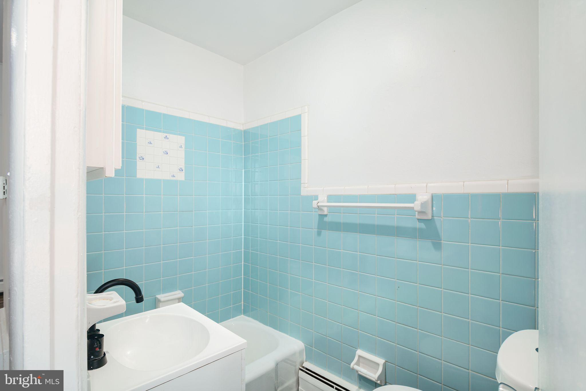 1024 Pine Street, Unit 2 Philadelphia, PA 19107 - Photo 5 of 7 a bathroom with a toilet sink and shower