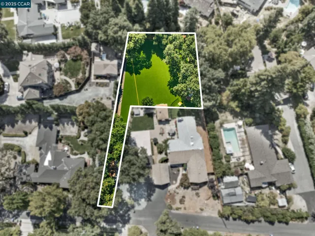 a bird view of house with green space