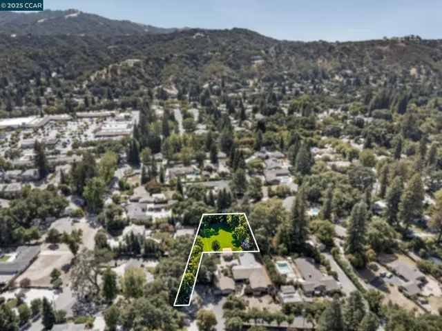 an aerial view of house with yard