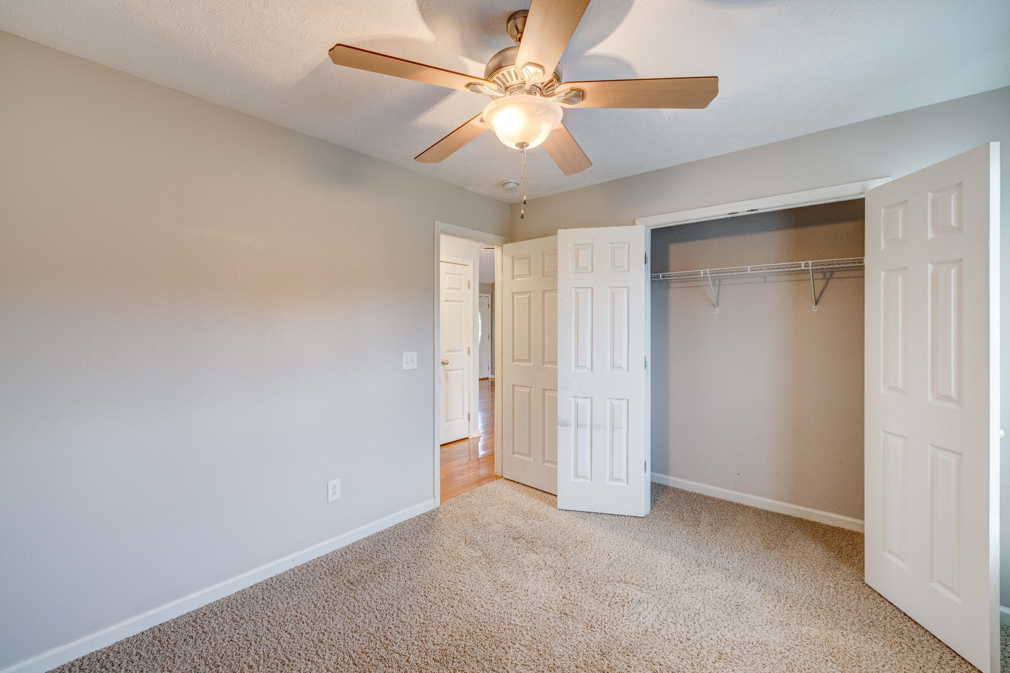 858 North Corinth Road Portland, TN 37148 - Photo 22 of 34 an empty room with closet and a ceiling fan