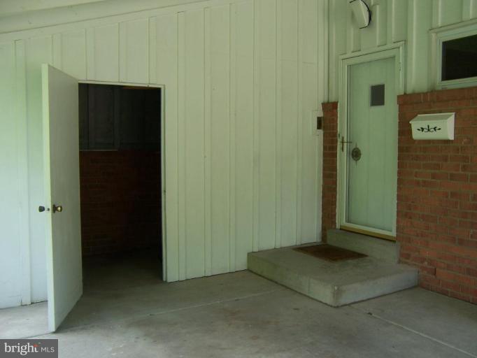 302 Sisson Street Silver Spring, MD 20902 - Photo 22 of 30 Carport with bonus storage area for lawn tools.