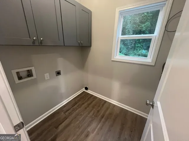 a view of a backyard with wooden fence