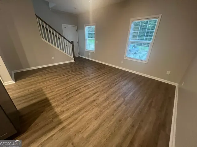 a view of a hallway view with staircase
