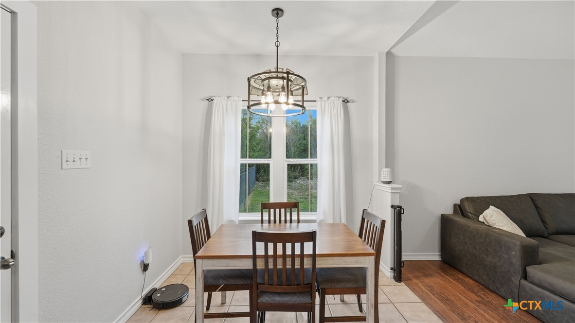 2216 Hornsby Spring Branch, TX 78070 - Photo 10 of 33 a view of a dining room with furniture window and outside view