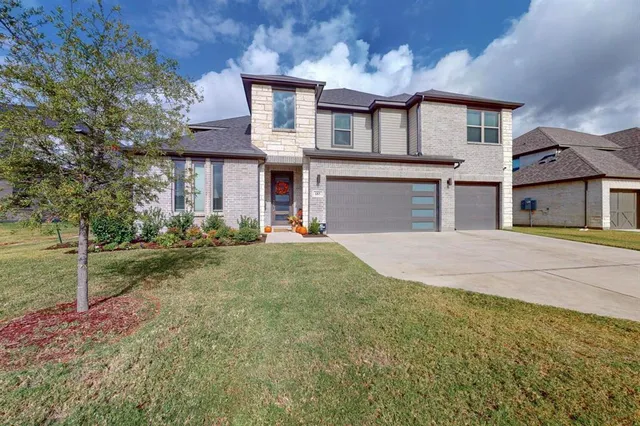 front view of a house with a yard