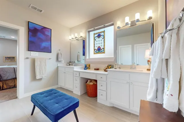 a room with furniture a table and painting on the wall