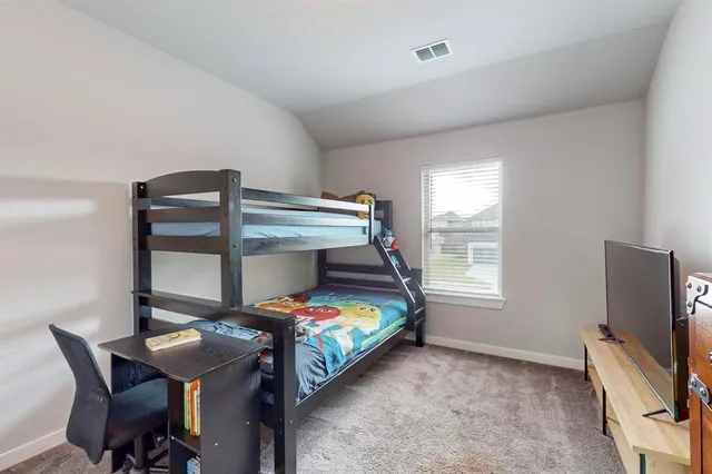 a bedroom with a bed and painted walls