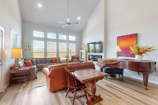 a kitchen with stainless steel appliances a sink a stove and white cabinets