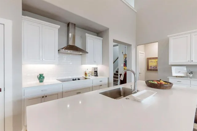 a spacious bedroom with a bed and window