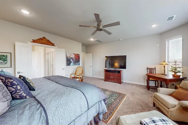 a kitchen with a sink cabinets and wooden floor