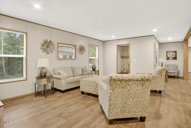 a living room with furniture and a window