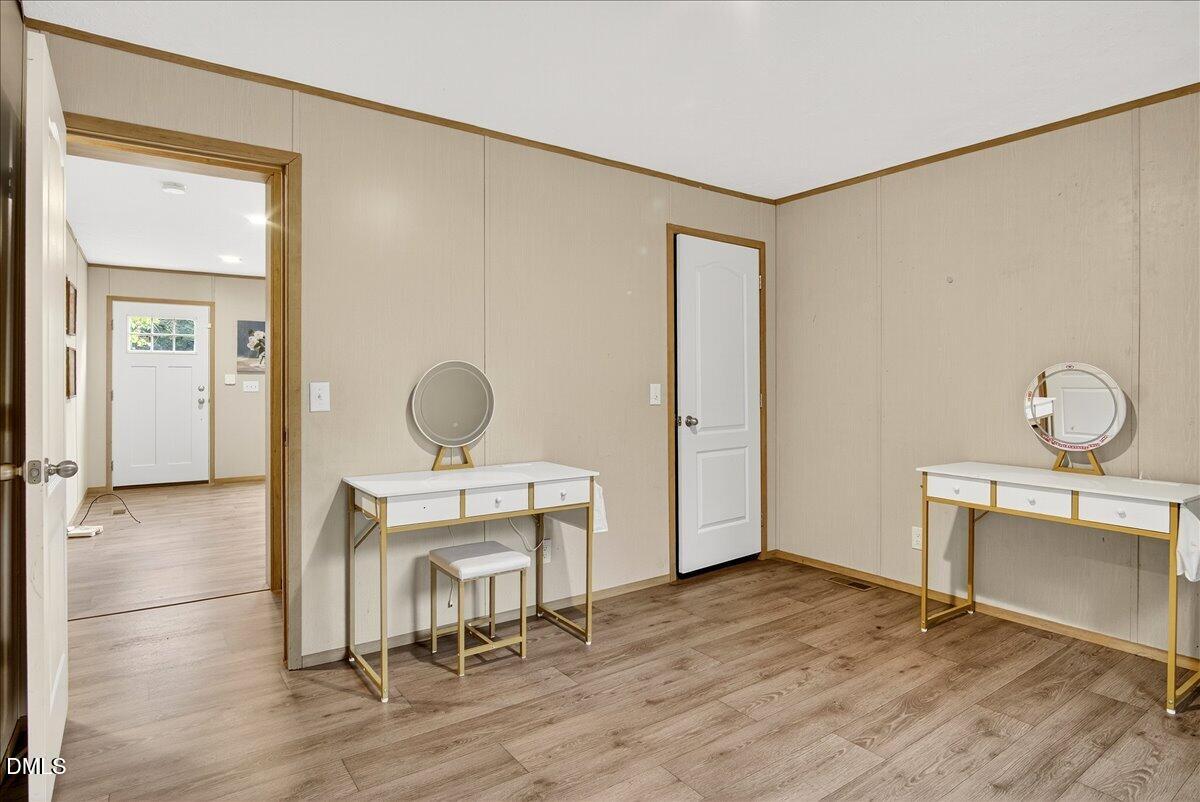 532 Plum Nutty Road Henderson, NC 27537 - Photo 20 of 38 a view of a room with wooden floor cabinet and windows