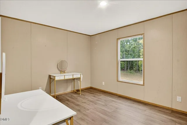 a room with a sink and a stove top oven