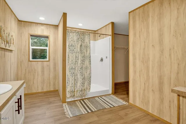 a view of a bathroom with a shower curtain