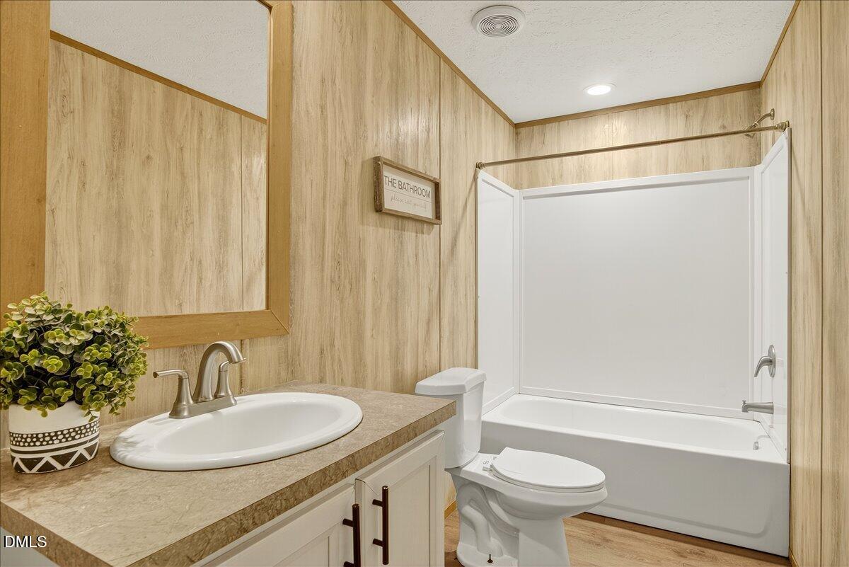 532 Plum Nutty Road Henderson, NC 27537 - Photo 25 of 38 a bathroom with a sink a toilet and shower
