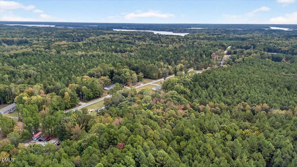 532 Plum Nutty Road Henderson, NC 27537 - Photo 35 of 38 an aerial view of residential houses with outdoor space and trees