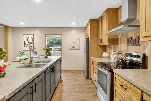 a kitchen with a sink stove and cabinets