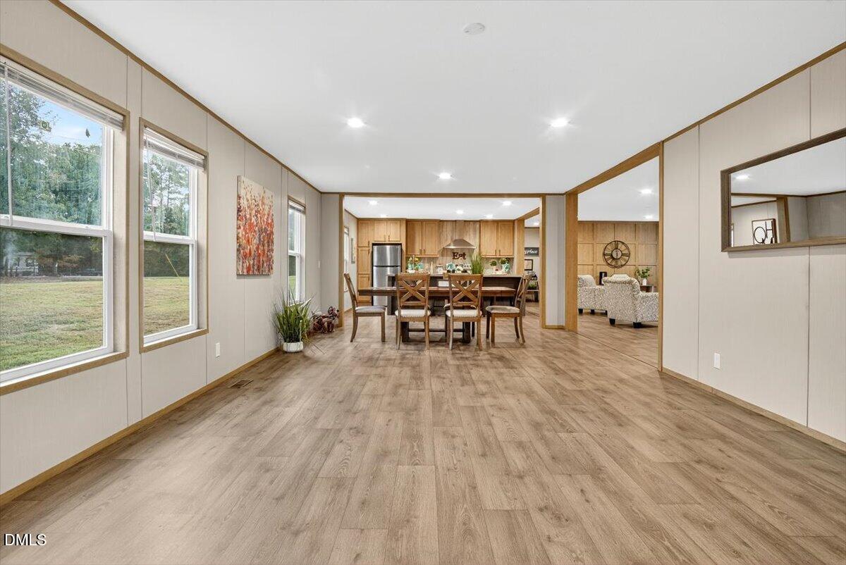 532 Plum Nutty Road Henderson, NC 27537 - Photo 9 of 38 a view of a livingroom with furniture wooden floor and a large window