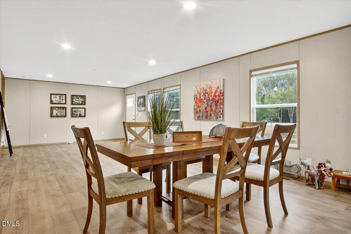 532 Plum Nutty Road Henderson, NC 27537 - Photo 10 of 38 a view of a dining room with furniture and wooden floor