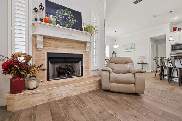 a living room with furniture a fireplace and a fireplace