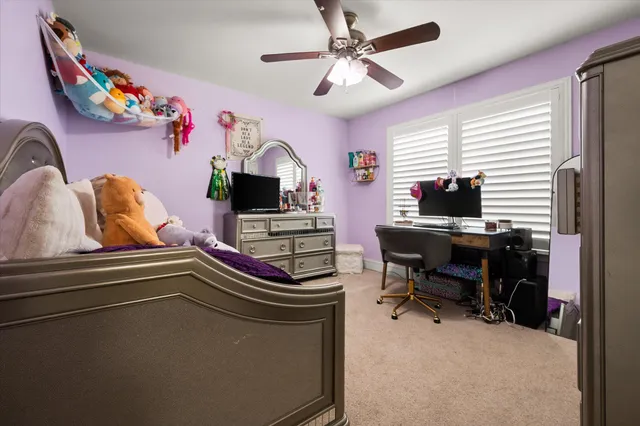 a work room with furniture and a window