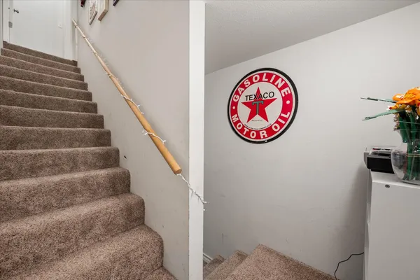 a view of staircase with wooden floor