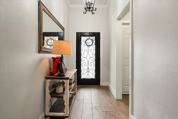 a view of an entryway with wooden floor